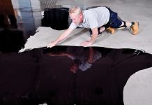 Smoothing subfloors before applying a waterproof surface membrane